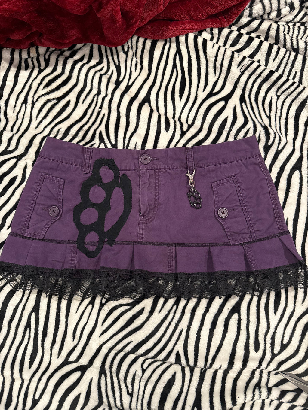 purple & black brass knuckle skirt size L