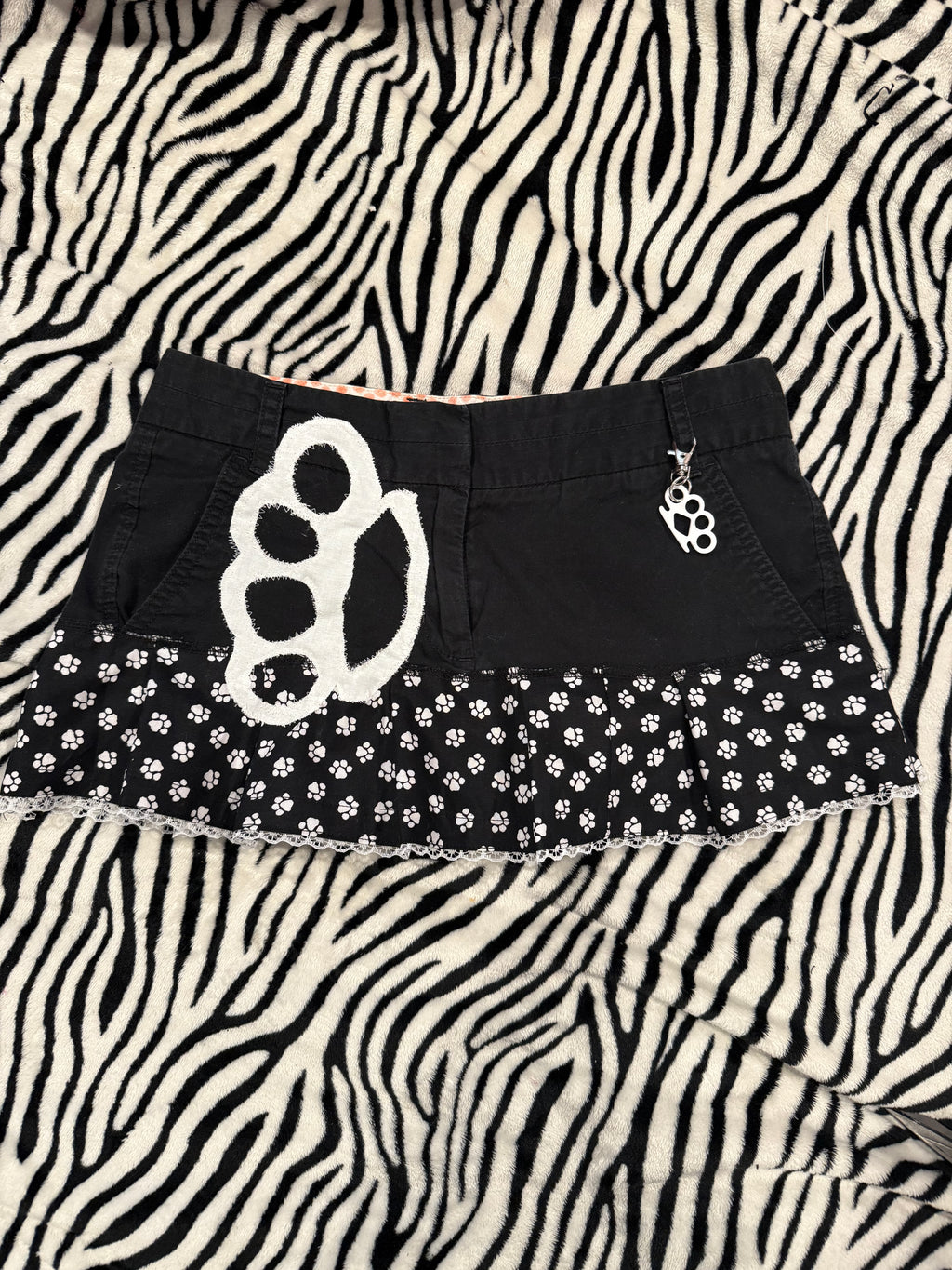 brass knuckle paw print skirt size xs/s